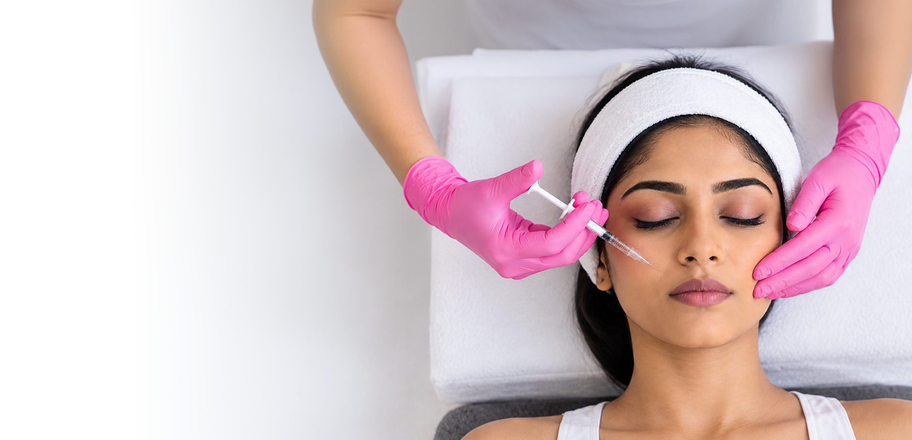 Doctor administering a facial injectable treatment at Dr. Nishita's Clinic